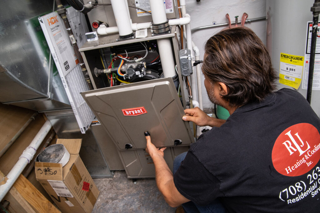 Man repairing Bryant Furnace